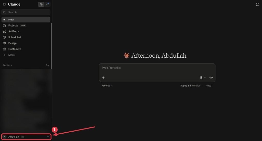 Claude home screen with the account name in the lower-left corner highlighted